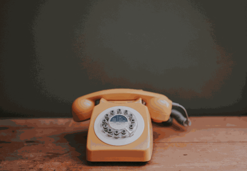 Vintage amber rotary telephone